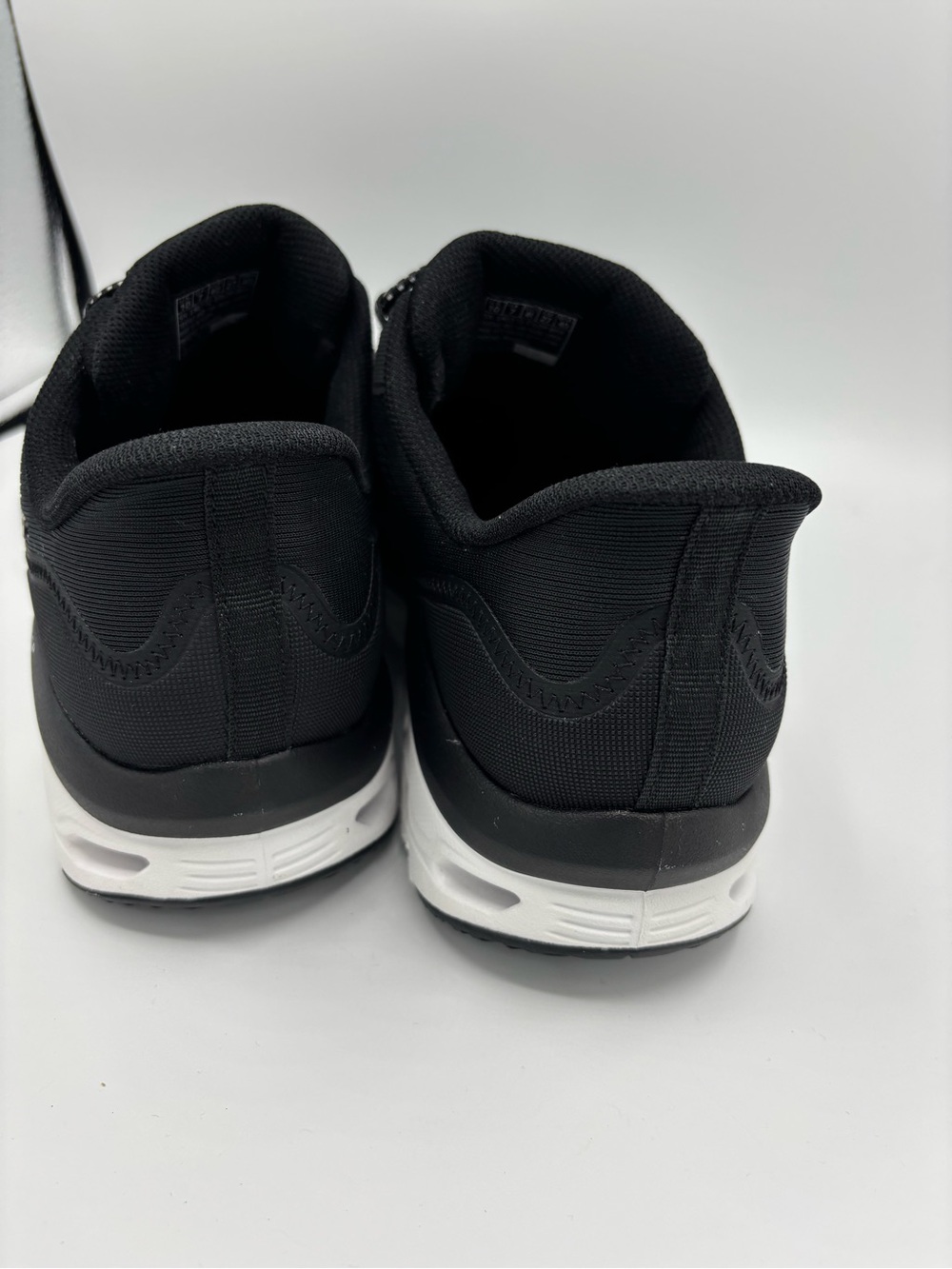Skechers Women's Black and White Glide-Step Adventure Slip-On Sneakers - Picture 6 of 9